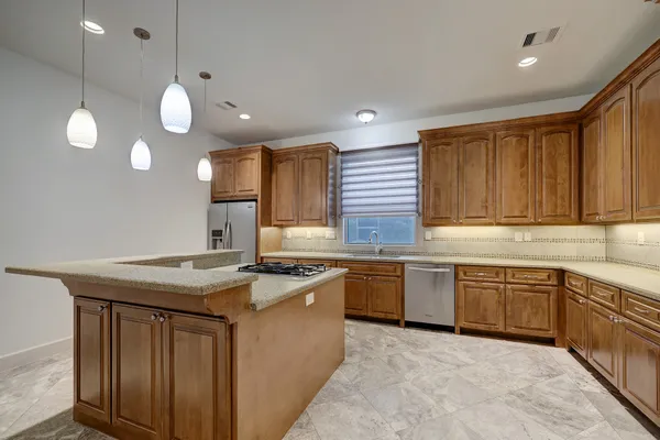 a kitchen with lots of counter space and a sink
