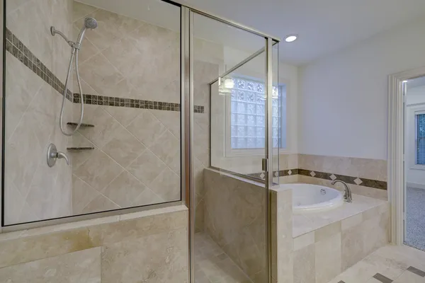 a bathroom with a sink and shower
