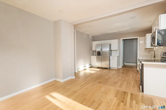 a view of a kitchen with a sink