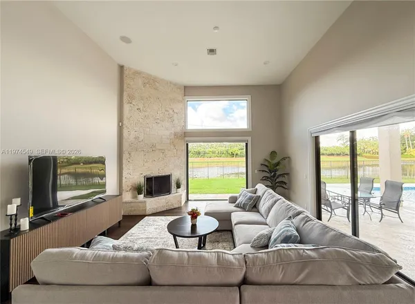 a spacious bathroom with a granite countertop tub sink and mirror