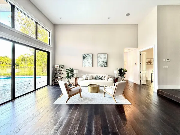a living room with fireplace furniture and a flat screen tv