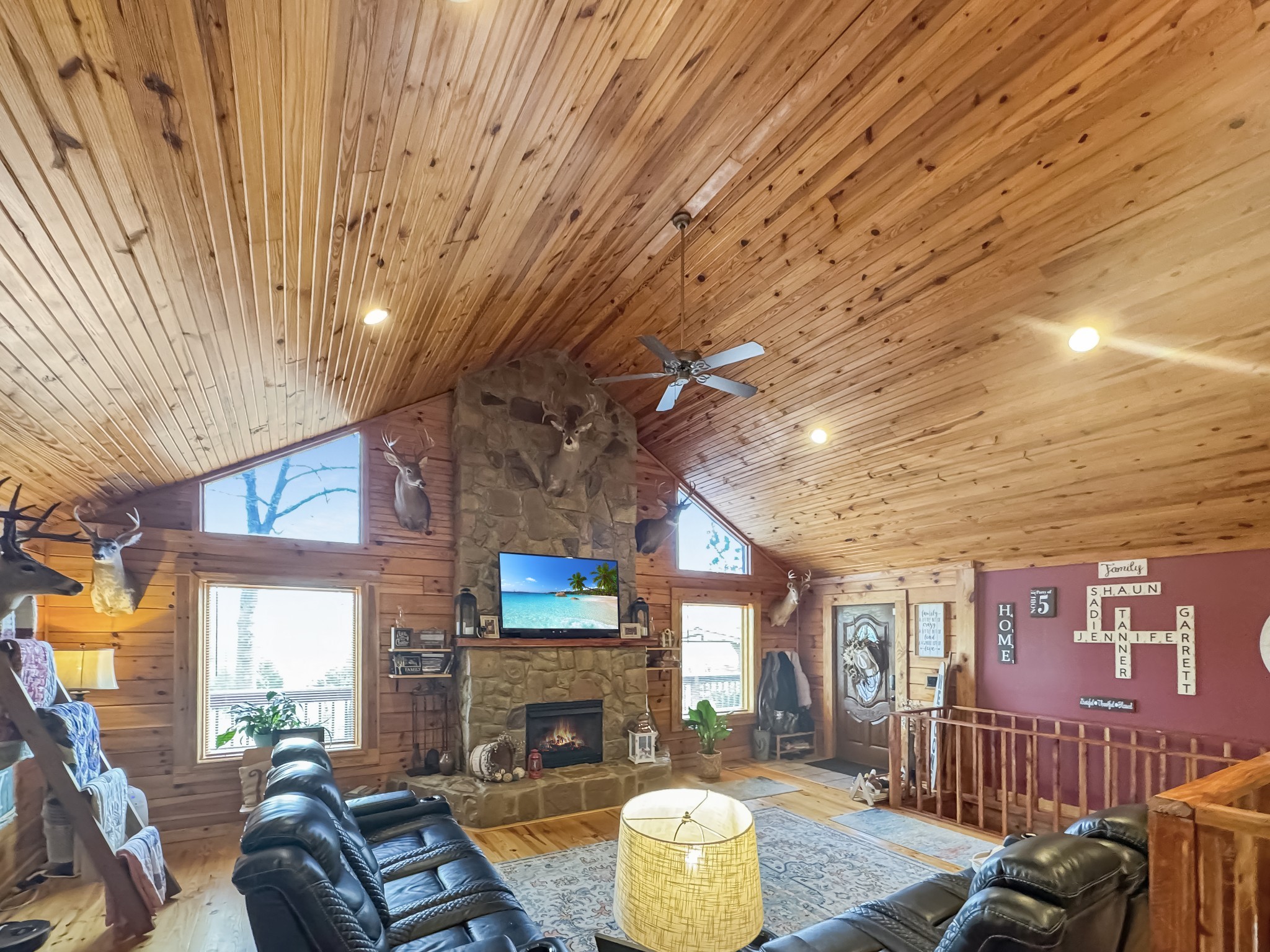 130 Wayne Threatt Road Dover, TN 37058 - Photo 12 of 28 a living room with furniture a fireplace and a flat screen tv