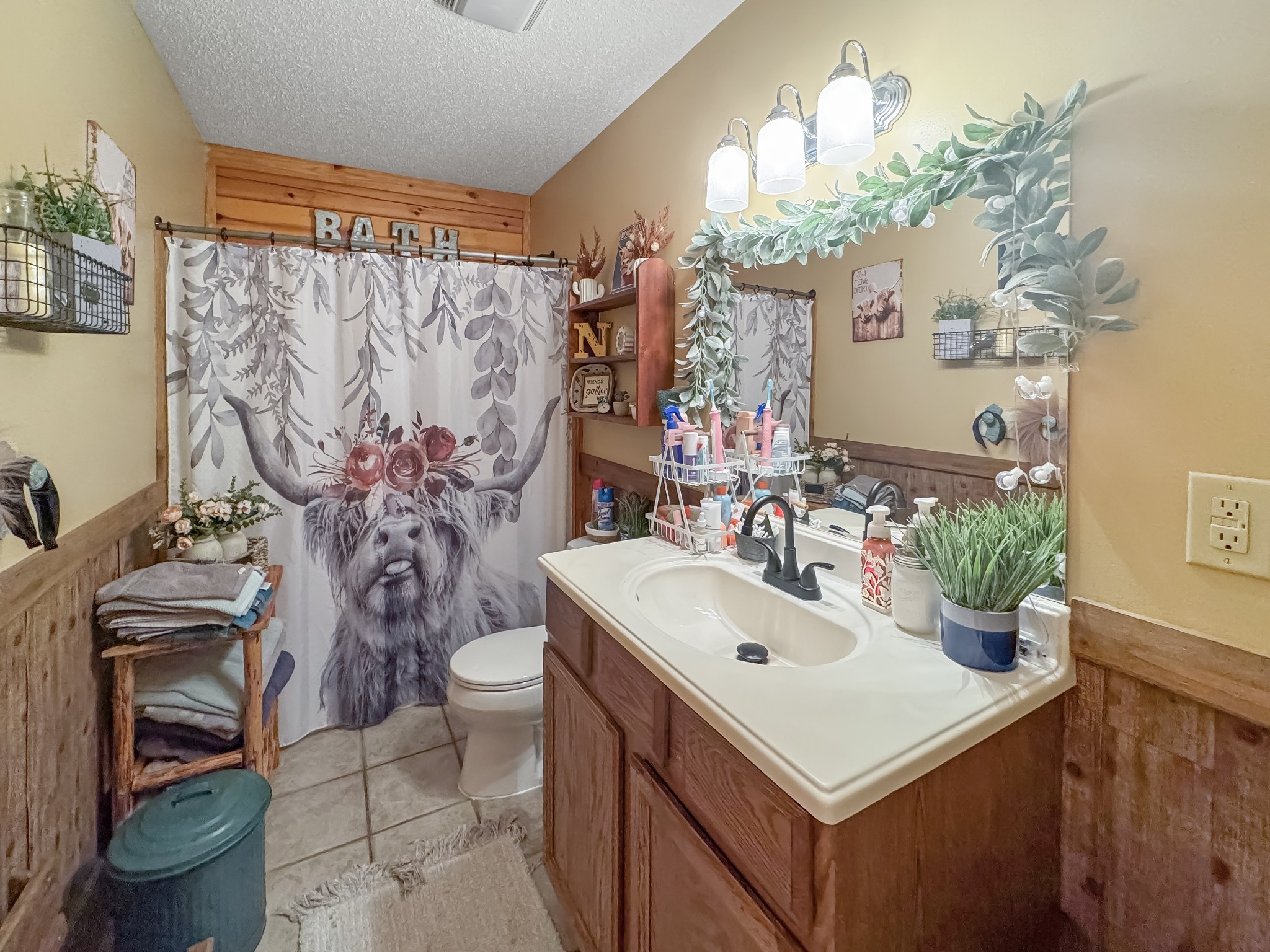 130 Wayne Threatt Road Dover, TN 37058 - Photo 16 of 28 a bathroom with a sink a toilet and shower curtain
