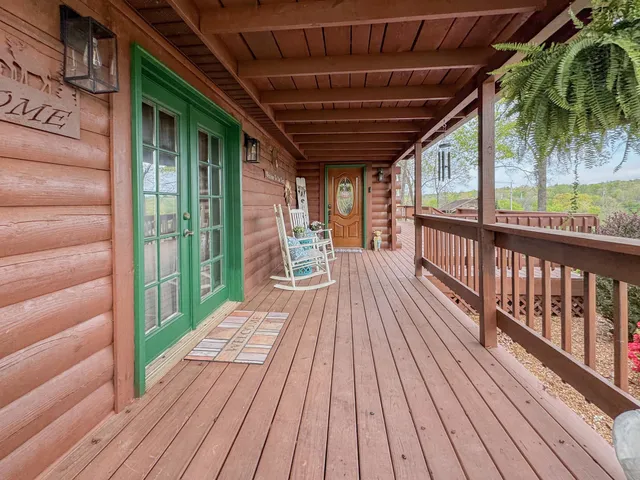 a view of balcony with wooden floor