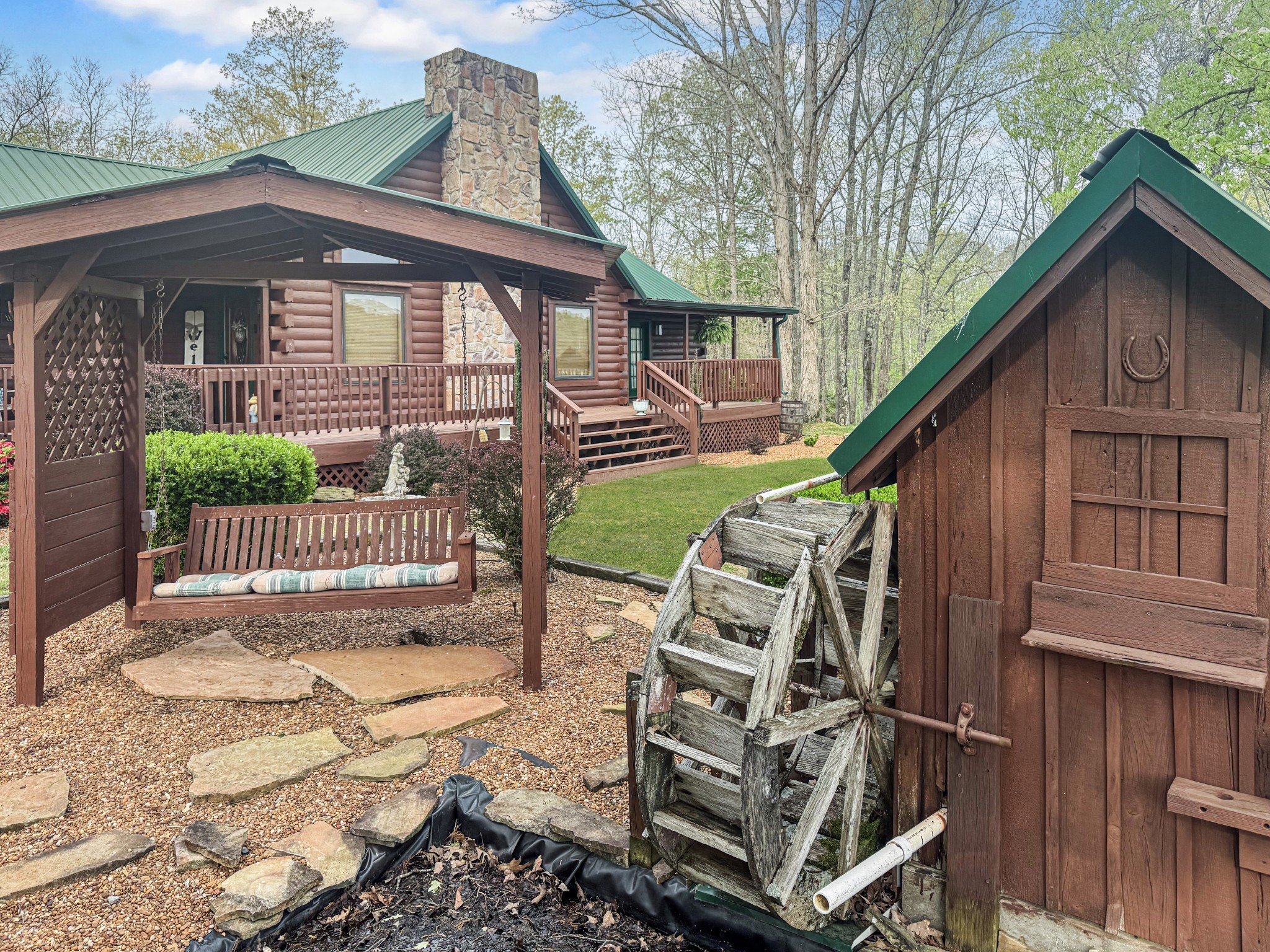 130 Wayne Threatt Road Dover, TN 37058 - Photo 5 of 28 a view of a house with wooden deck and furniture