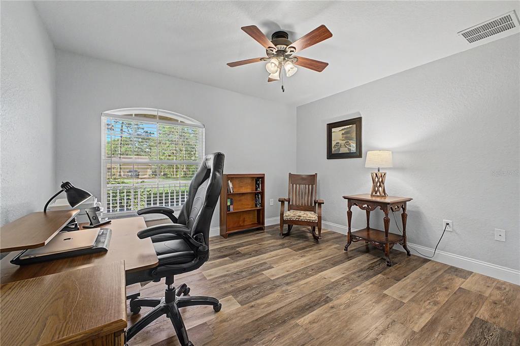 11213 Flock Avenue Weeki Wachee, FL 34613 - Photo 18 of 46 a view of a workspace with furniture and a window