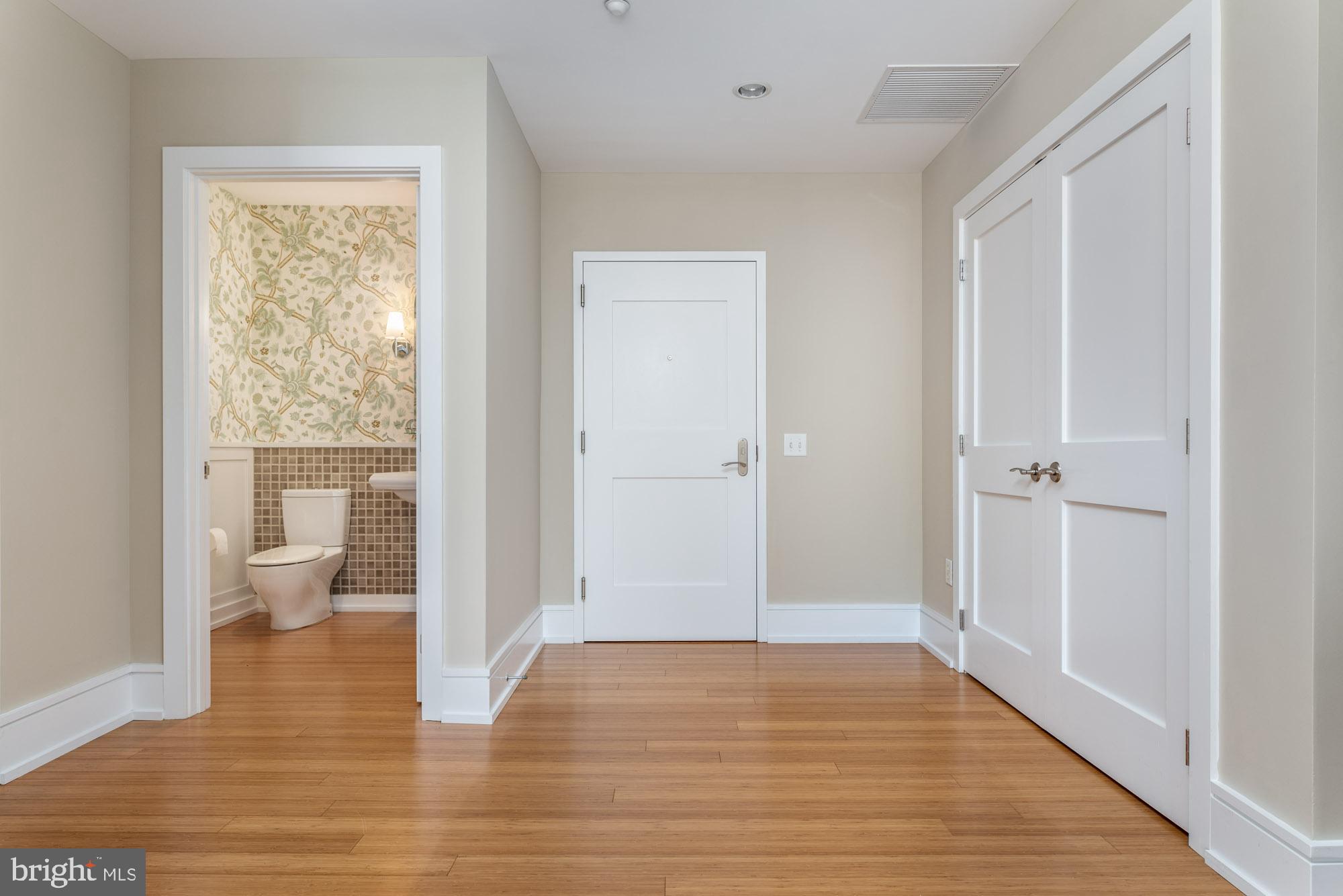 223 Iron Works Way Wayne, PA 19087 - Photo 18 of 23 a view of an empty room with wooden floor and a window