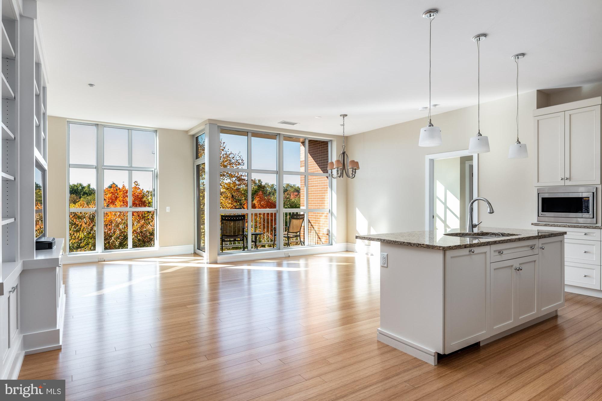 223 Iron Works Way Wayne, PA 19087 - Photo 2 of 23 a view of a kitchen with stainless steel appliances granite countertop a stove and a wooden floors
