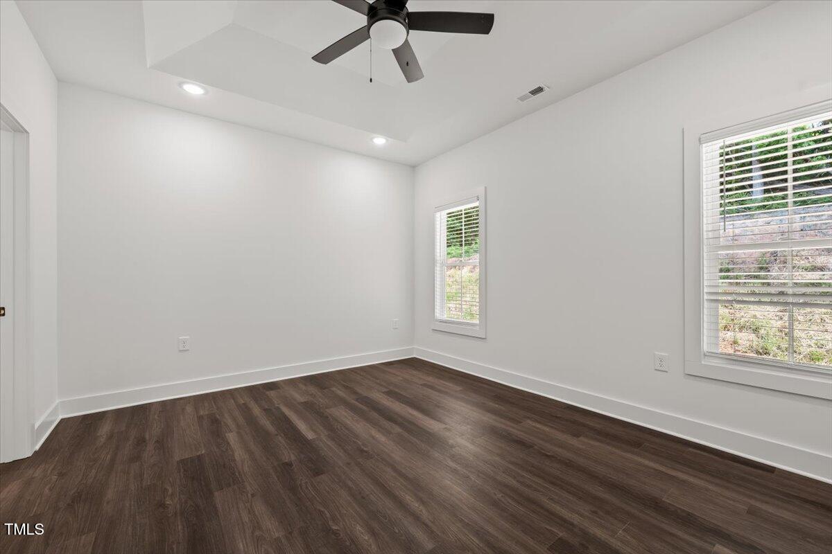 130 Old Heritage Road Randleman, NC 27317 - Photo 16 of 24 wooden floor in an empty room with a window