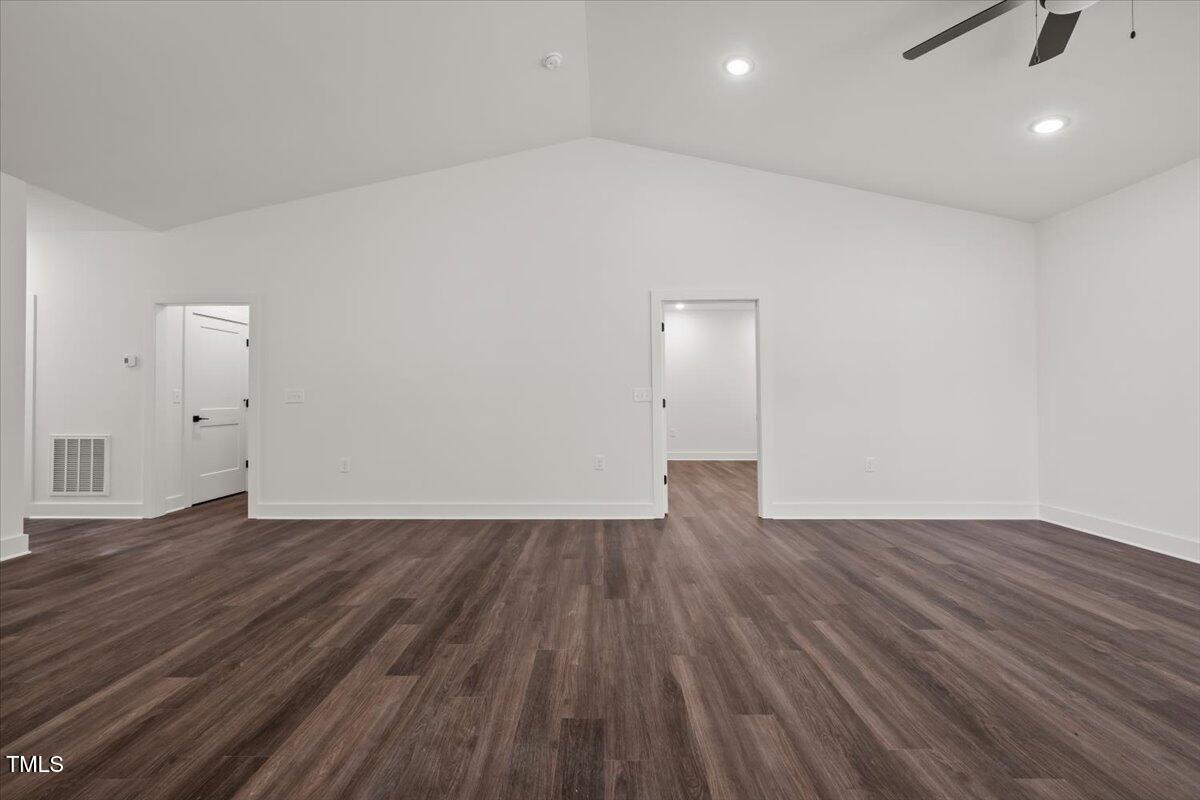 130 Old Heritage Road Randleman, NC 27317 - Photo 17 of 24 an empty room with wooden floor and windows