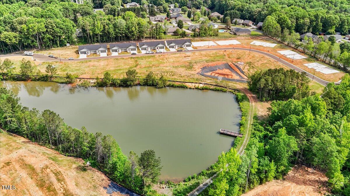 130 Old Heritage Road Randleman, NC 27317 - Photo 3 of 24 an aerial view of residential houses with outdoor space and lake view