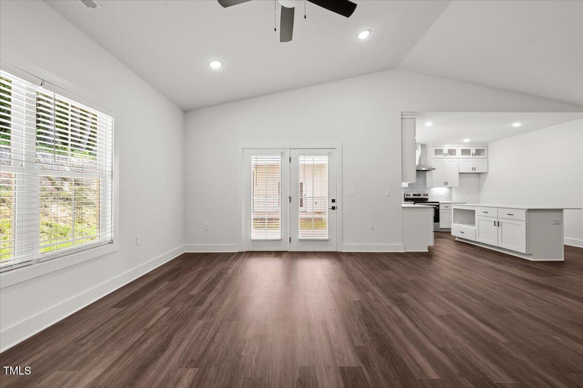 130 Old Heritage Road Randleman, NC 27317 - Photo 9 of 24 a view of a kitchen with wooden floor and a window
