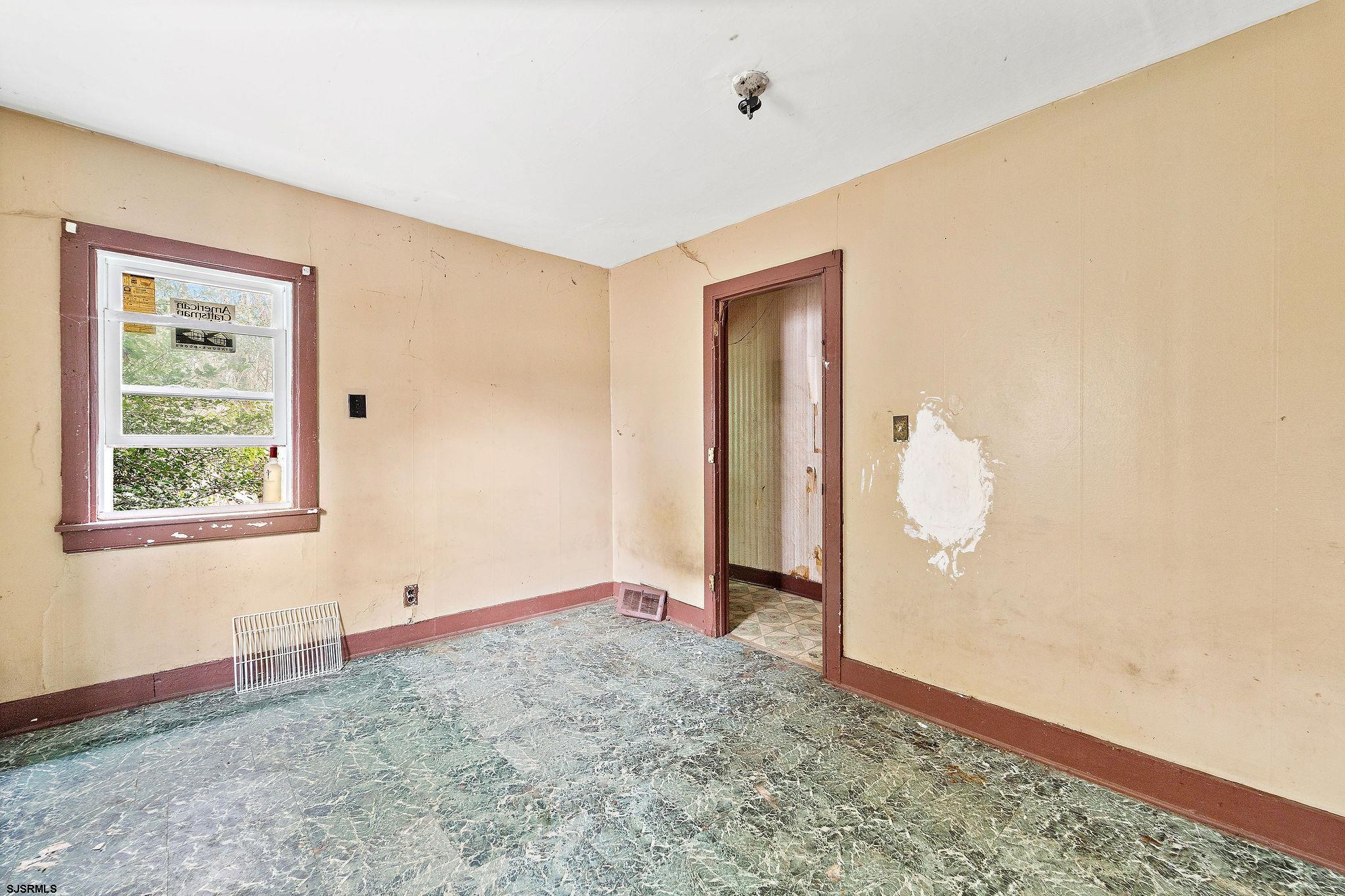 39 Cedar Street Bridgeton, NJ 08302 - Photo 11 of 19 a view of an empty room with a window