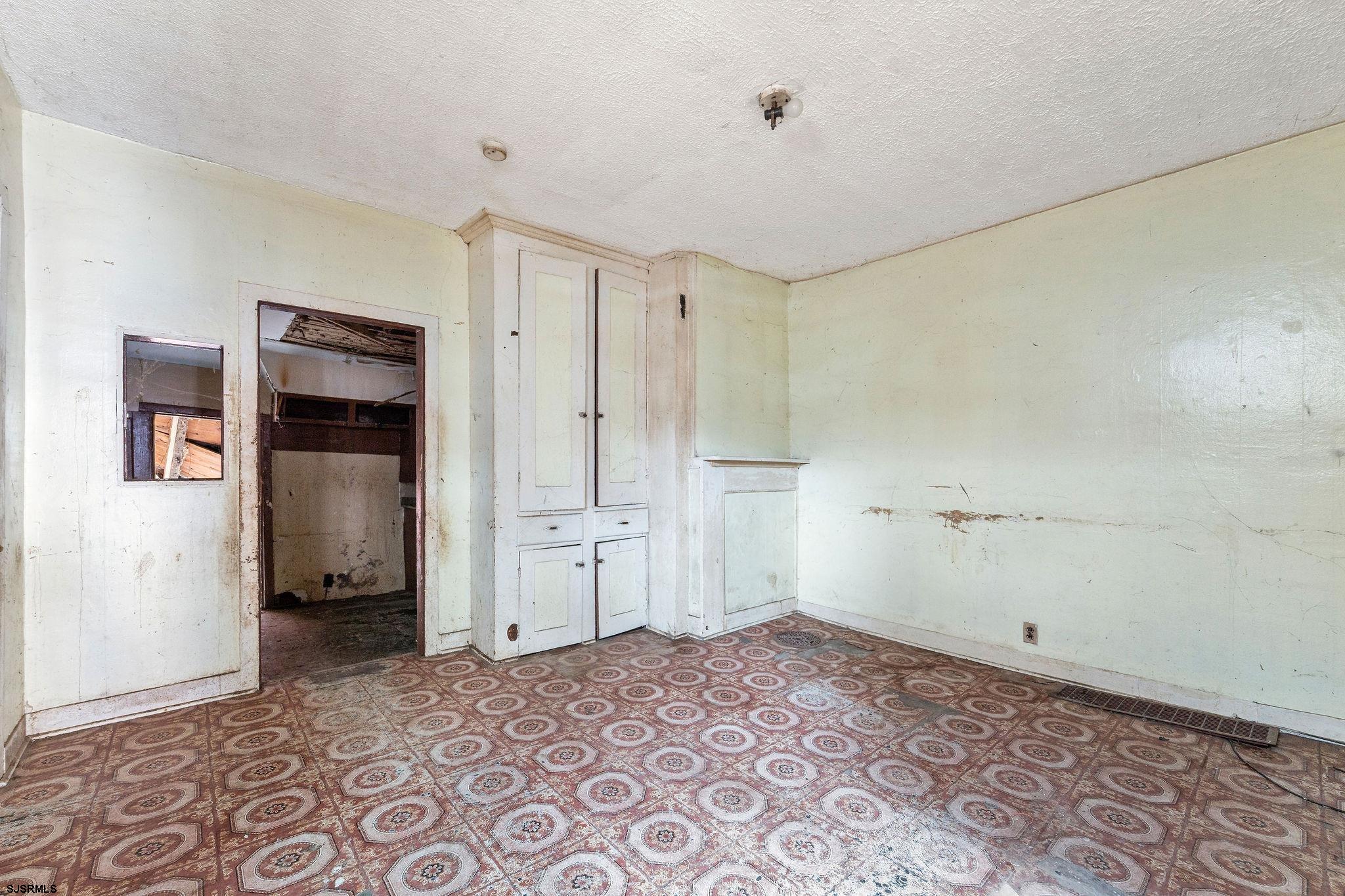 39 Cedar Street Bridgeton, NJ 08302 - Photo 16 of 19 a big room with closet and wooden door