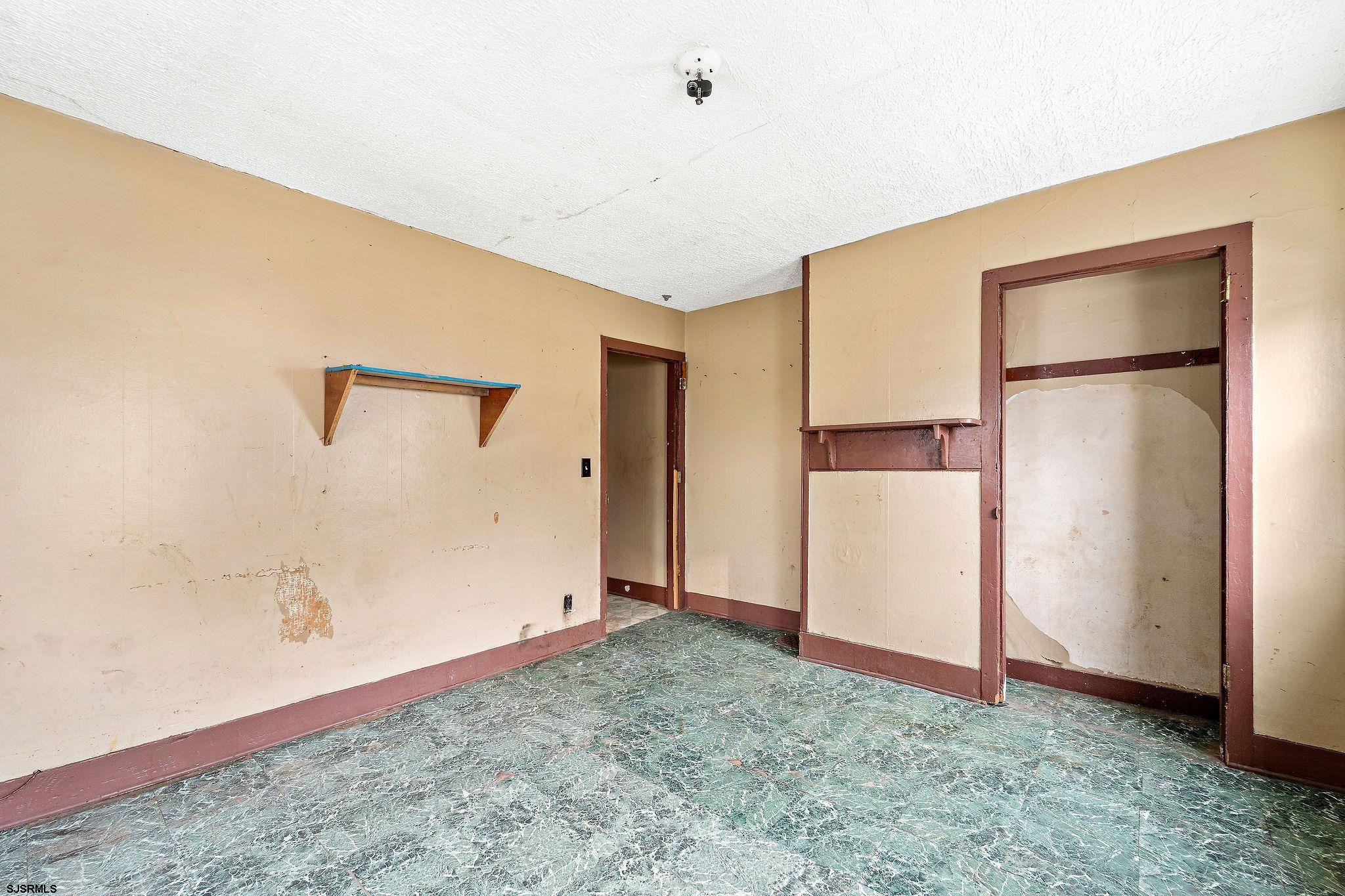 39 Cedar Street Bridgeton, NJ 08302 - Photo 10 of 19 a view of a livingroom with a refrigerator