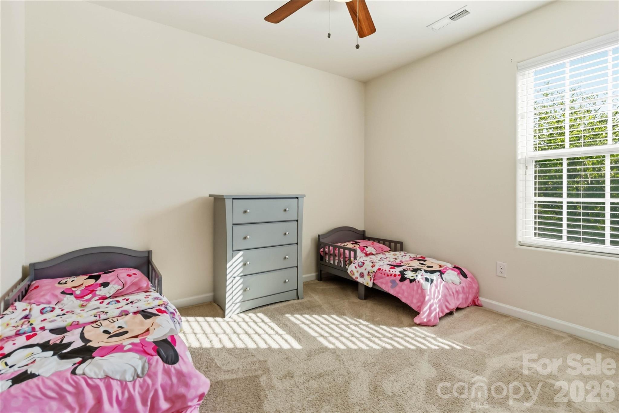 14015 Rory Glen Lane Charlotte, NC 28215 - Photo 18 of 28 a bedroom with a bed and a dresser