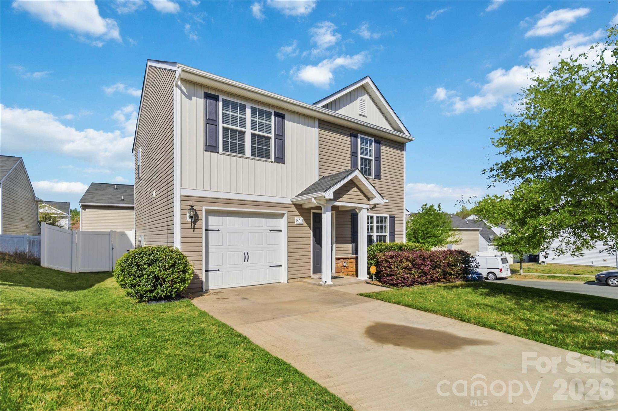 14015 Rory Glen Lane Charlotte, NC 28215 - Photo 2 of 28 a front view of a house with a yard and garage