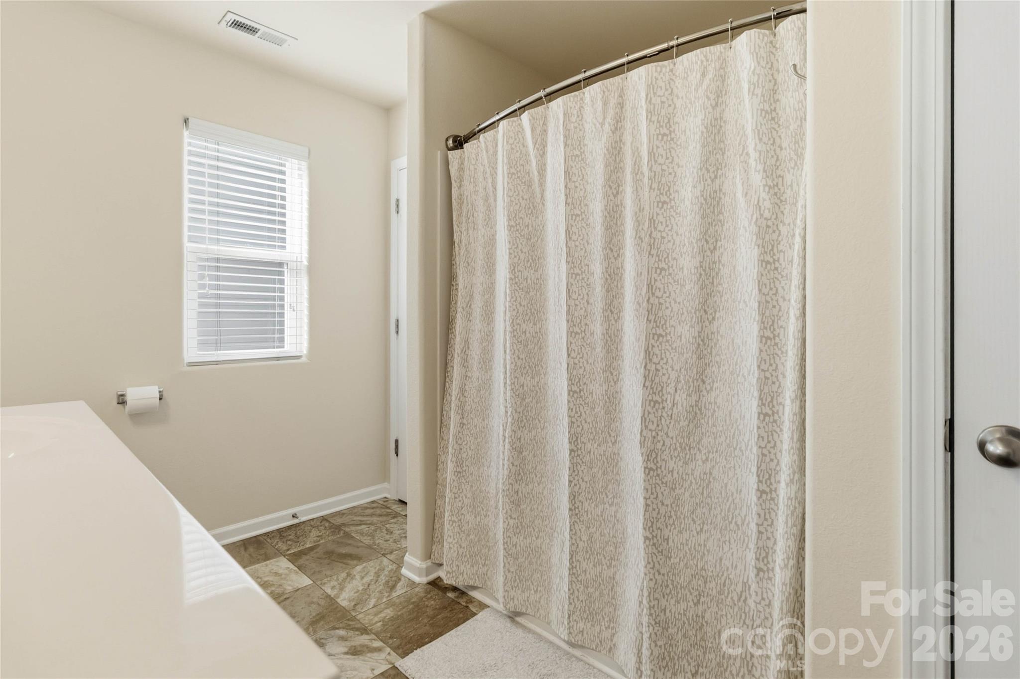 14015 Rory Glen Lane Charlotte, NC 28215 - Photo 22 of 28 a view of an empty room with a window