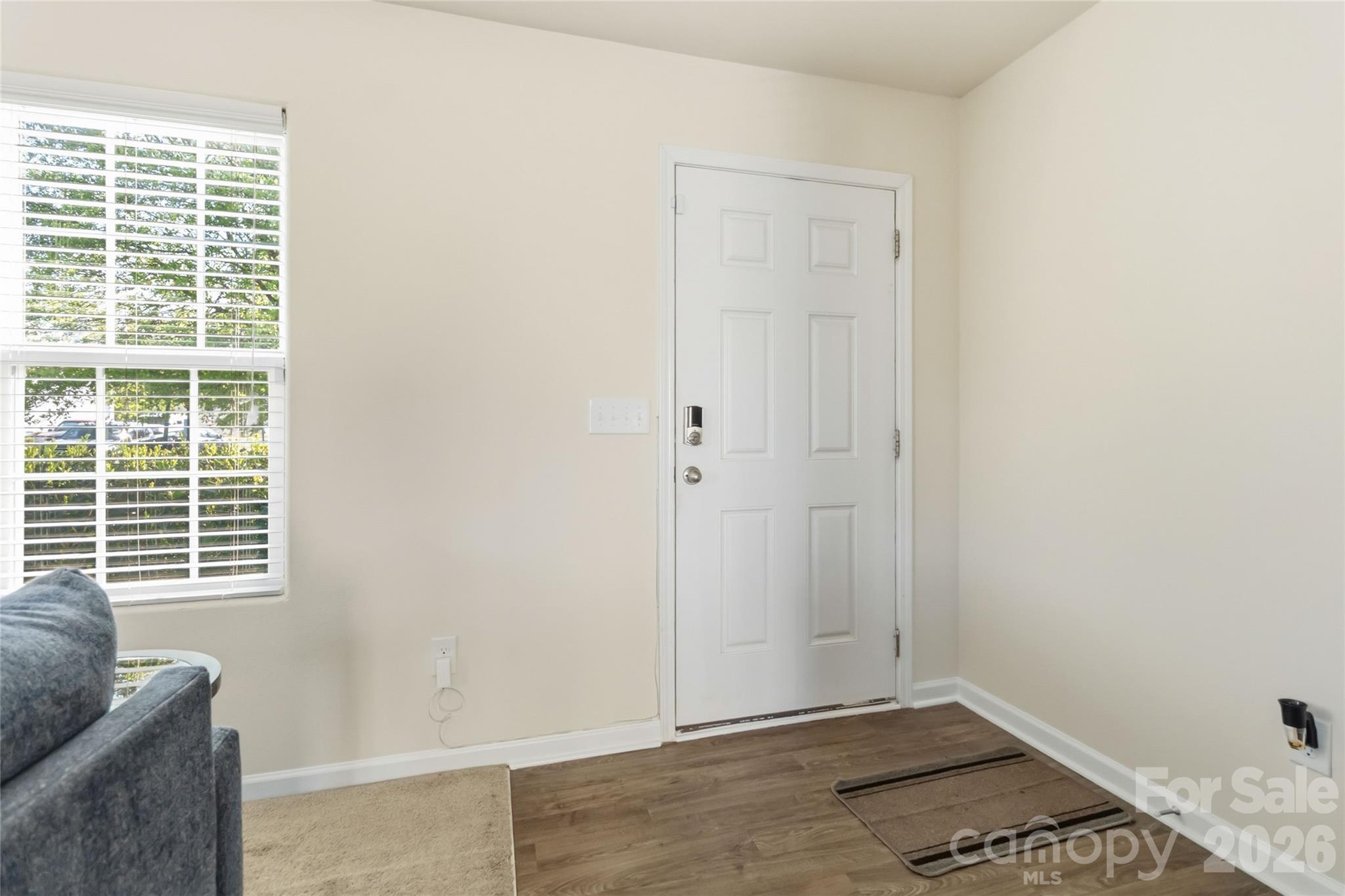 14015 Rory Glen Lane Charlotte, NC 28215 - Photo 6 of 28 a view of small space with wooden floor and a window