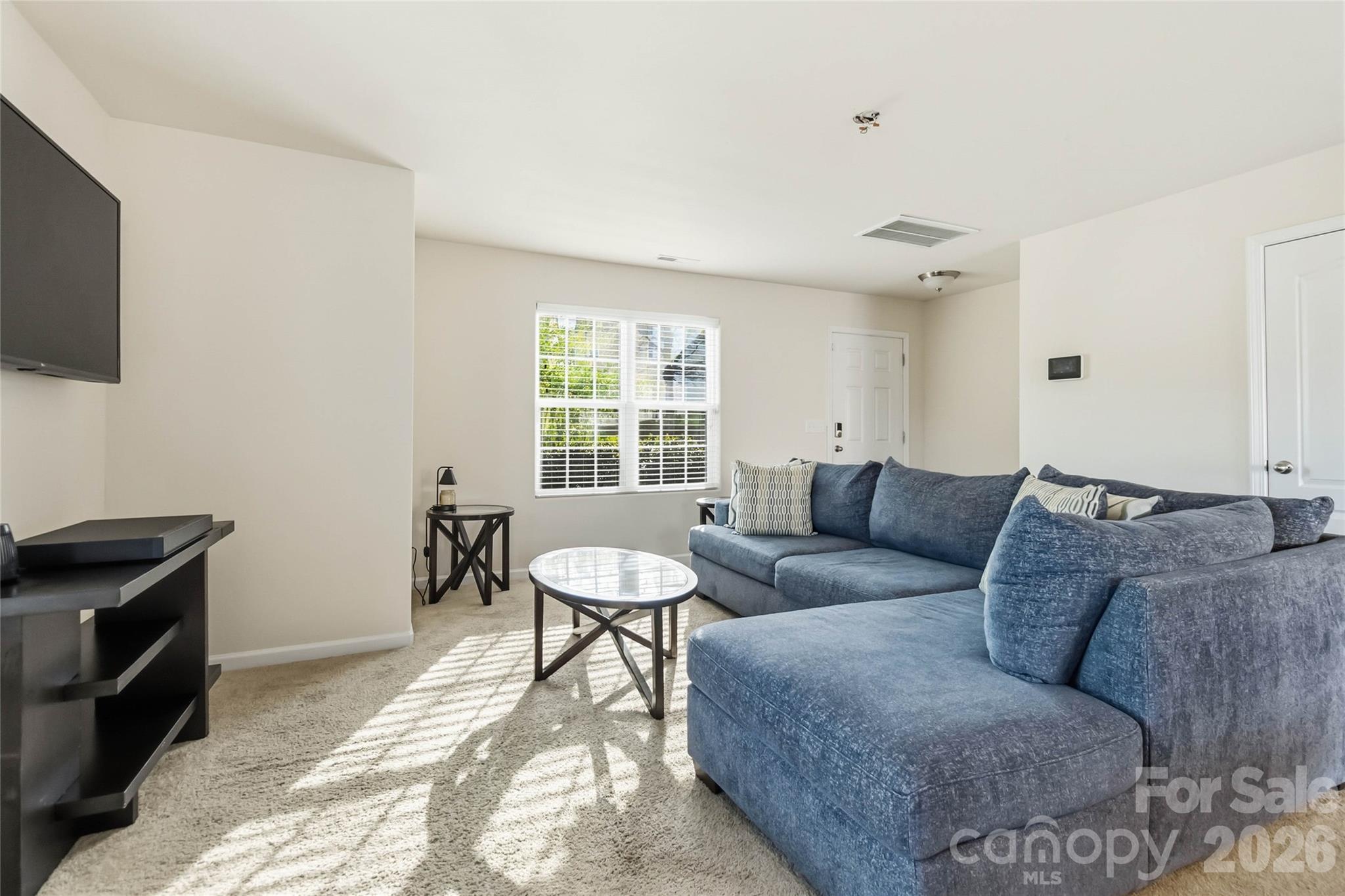 14015 Rory Glen Lane Charlotte, NC 28215 - Photo 8 of 28 a living room with furniture and a window