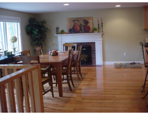 144 Tudor Road Needham, MA 02492 - Photo 3 of 5 a view of a dining room with furniture and wooden floor