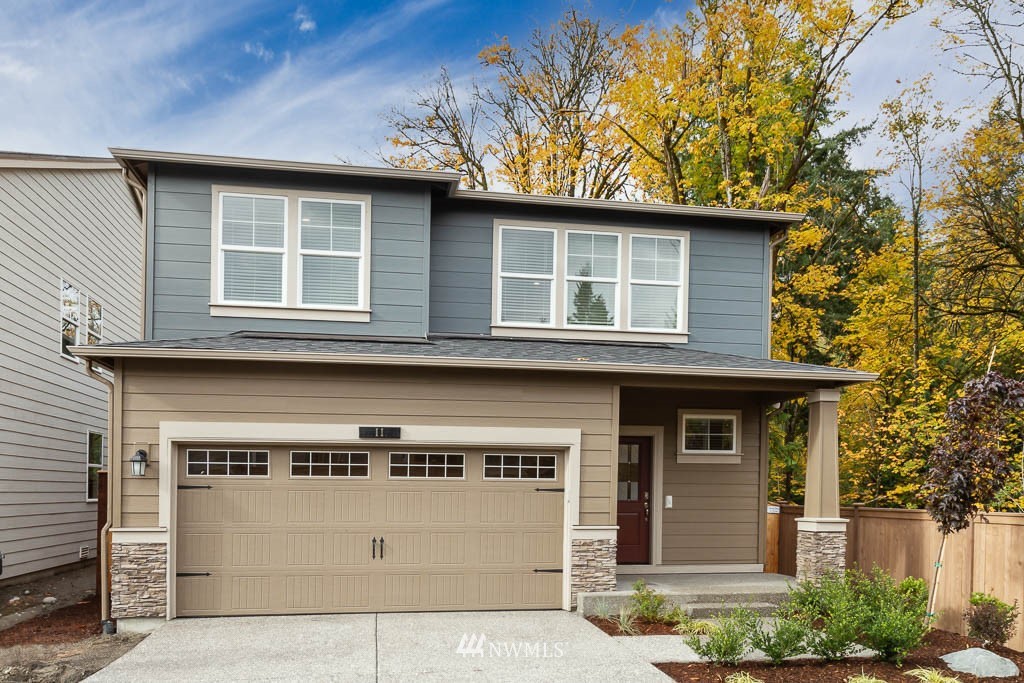104 211th Street Southeast, Unit P18 Bothell, WA 98021 - Photo 1 of 31 a front view of a house