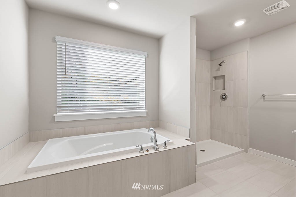 104 211th Street Southeast, Unit P18 Bothell, WA 98021 - Photo 24 of 31 a bathroom with a bathtub and shower