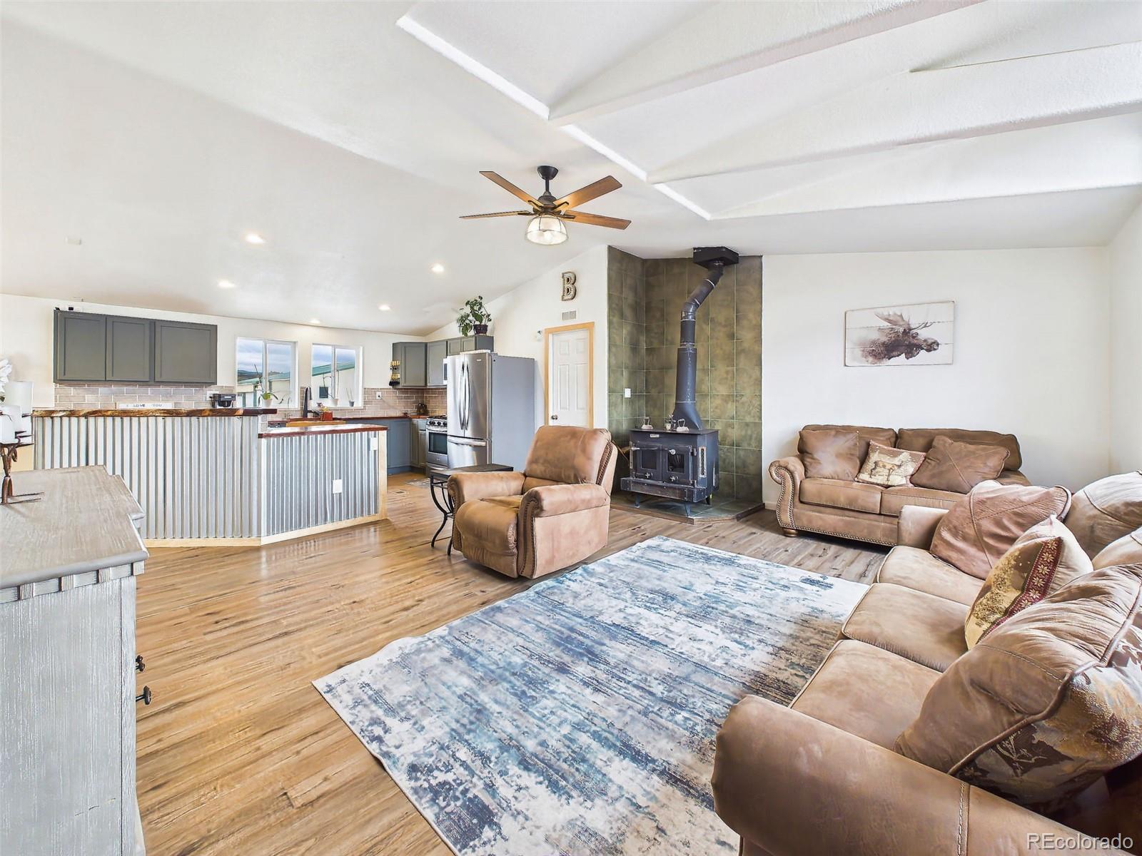 699 Cedar Hills Road Penrose, CO 81240 - Photo 17 of 50 a living room with furniture and kitchen view