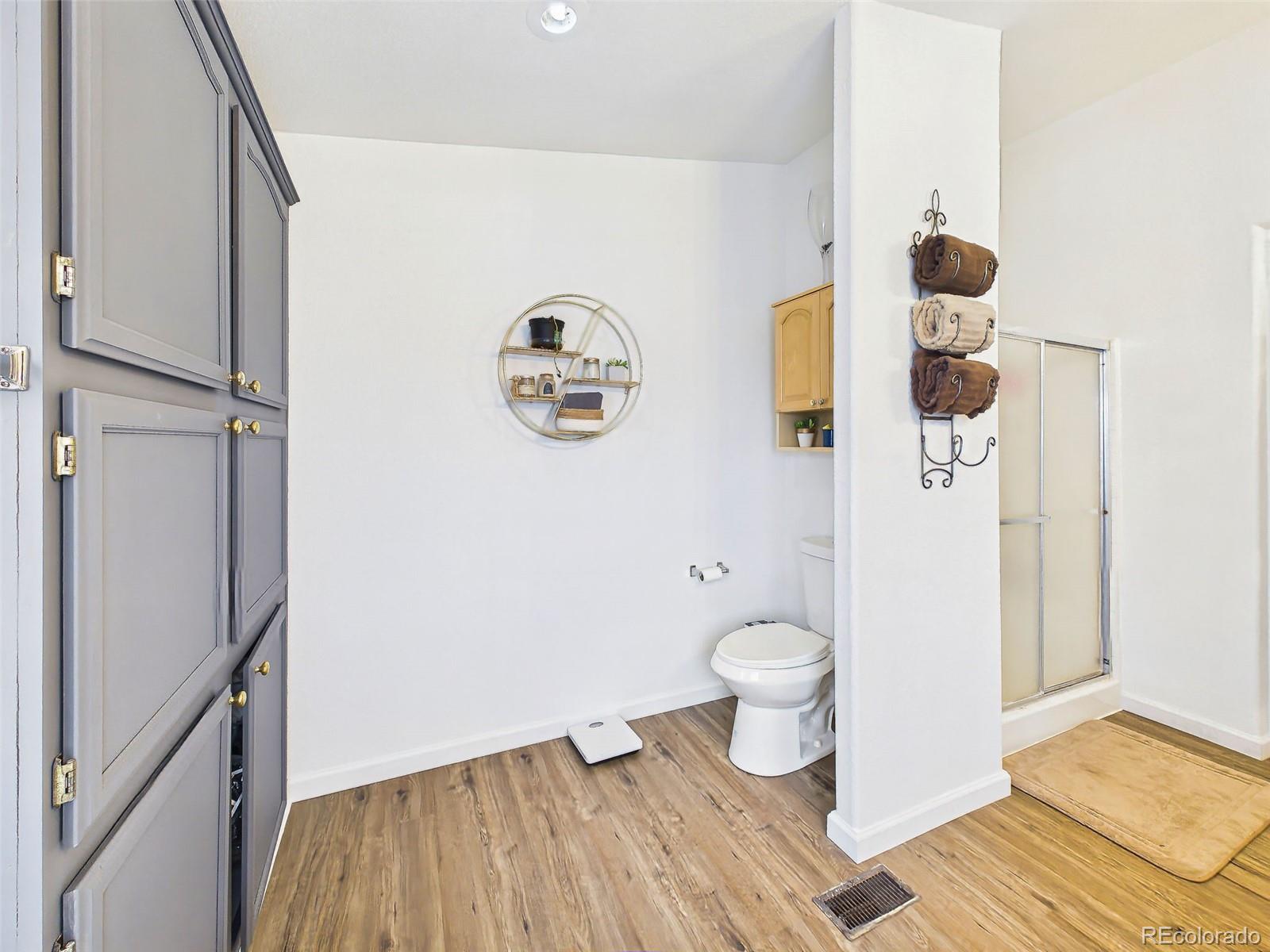699 Cedar Hills Road Penrose, CO 81240 - Photo 24 of 50 a bathroom with a toilet and a shower