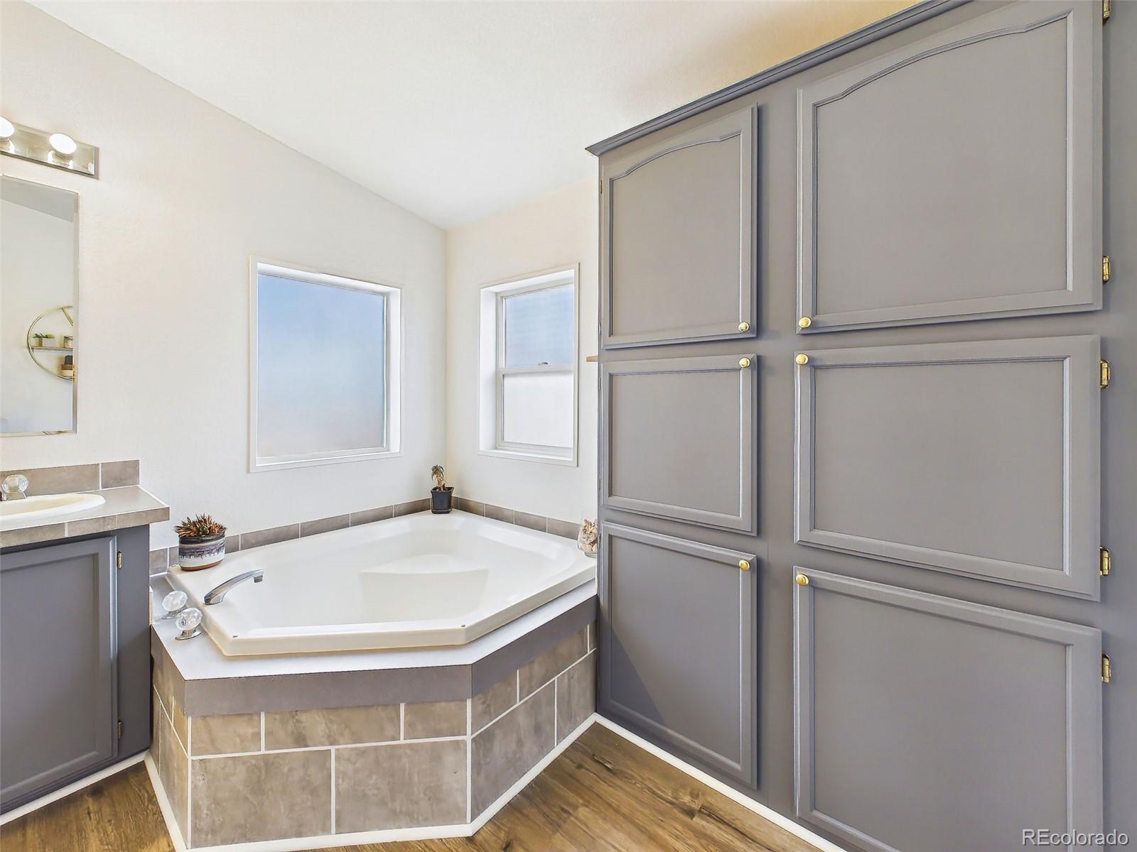 699 Cedar Hills Road Penrose, CO 81240 - Photo 25 of 50 a bathroom with a tub and shower