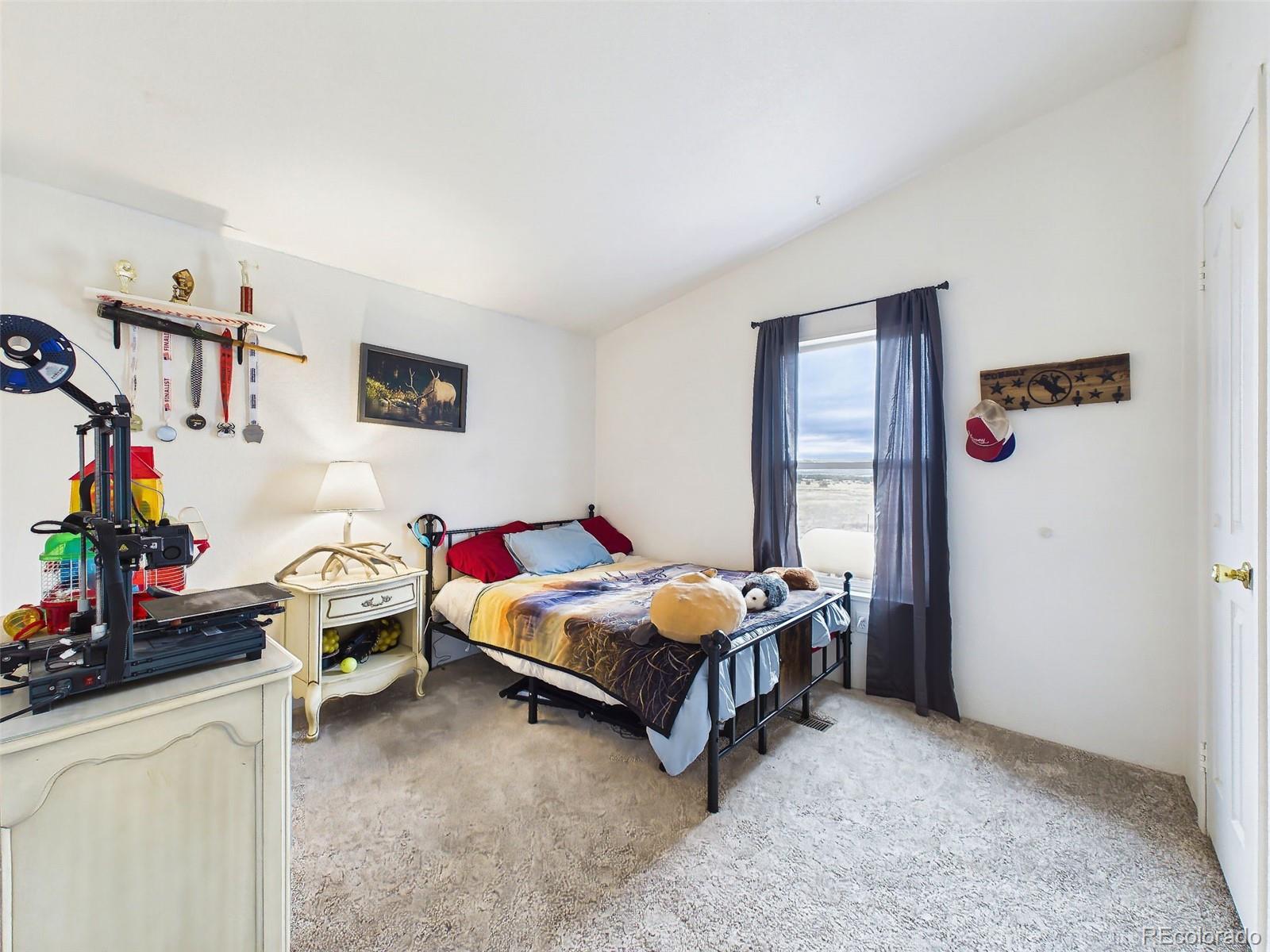 699 Cedar Hills Road Penrose, CO 81240 - Photo 28 of 50 a room with furniture and a table