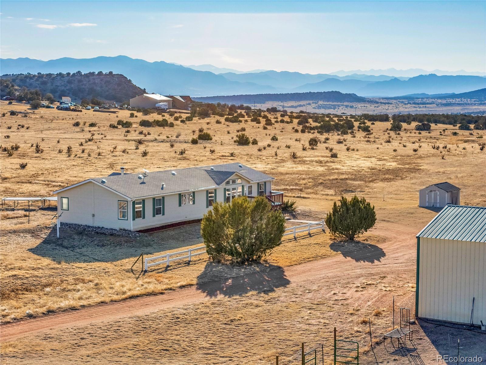 699 Cedar Hills Road Penrose, CO 81240 - Photo 32 of 50 a view of a water next to a building with a ocean view