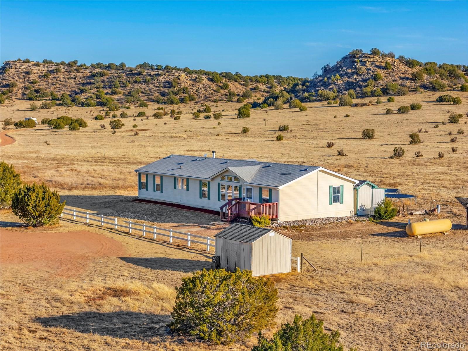 699 Cedar Hills Road Penrose, CO 81240 - Photo 33 of 50 a view of a house with a ocean view