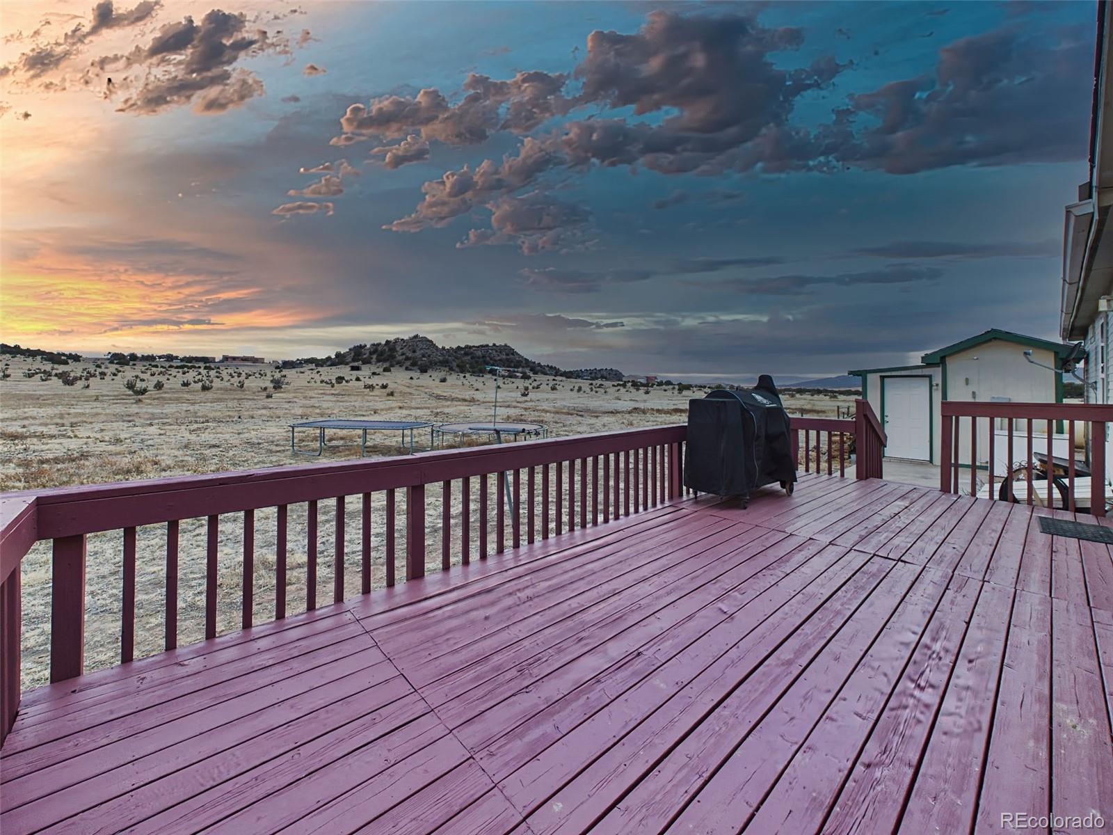 699 Cedar Hills Road Penrose, CO 81240 - Photo 36 of 50 a view of balcony with wooden floor
