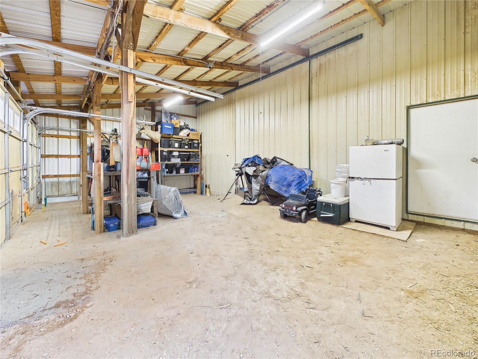 699 Cedar Hills Road Penrose, CO 81240 - Photo 42 of 50 a view of a room with gym equipment