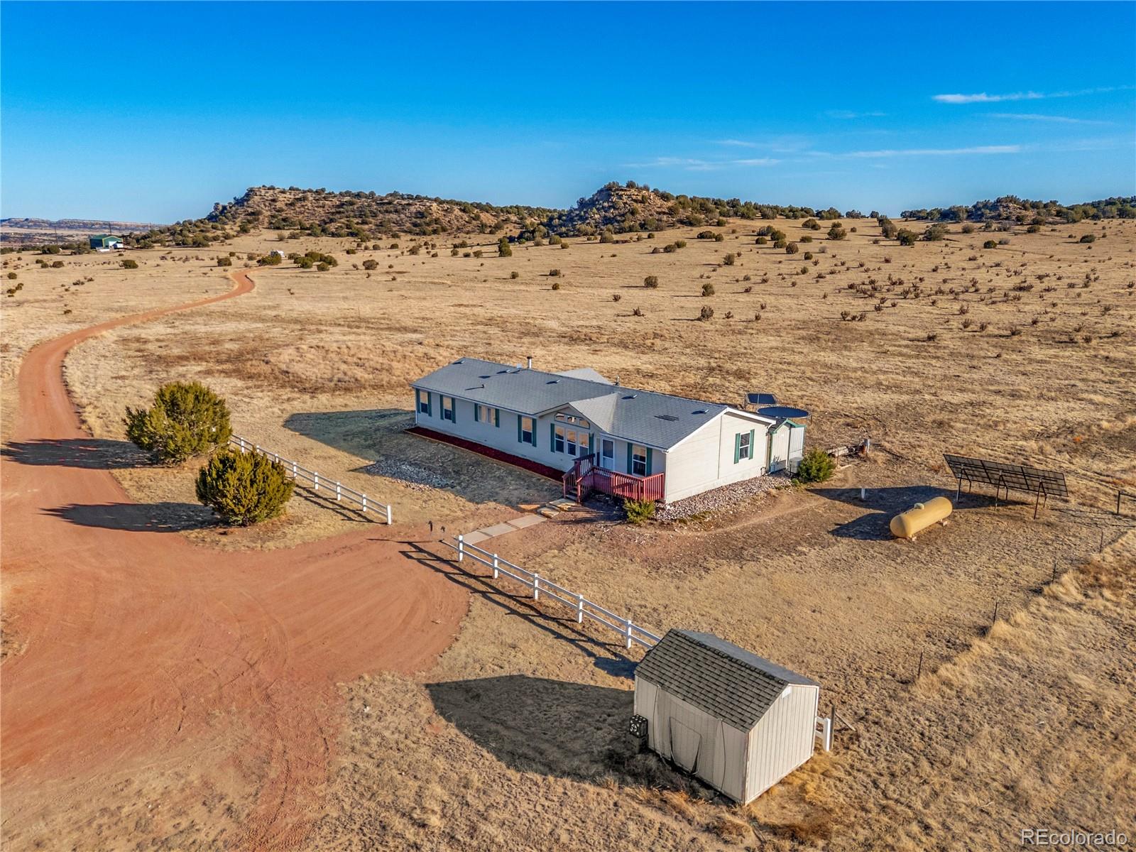 699 Cedar Hills Road Penrose, CO 81240 - Photo 46 of 50 a view of a house with a ocean view