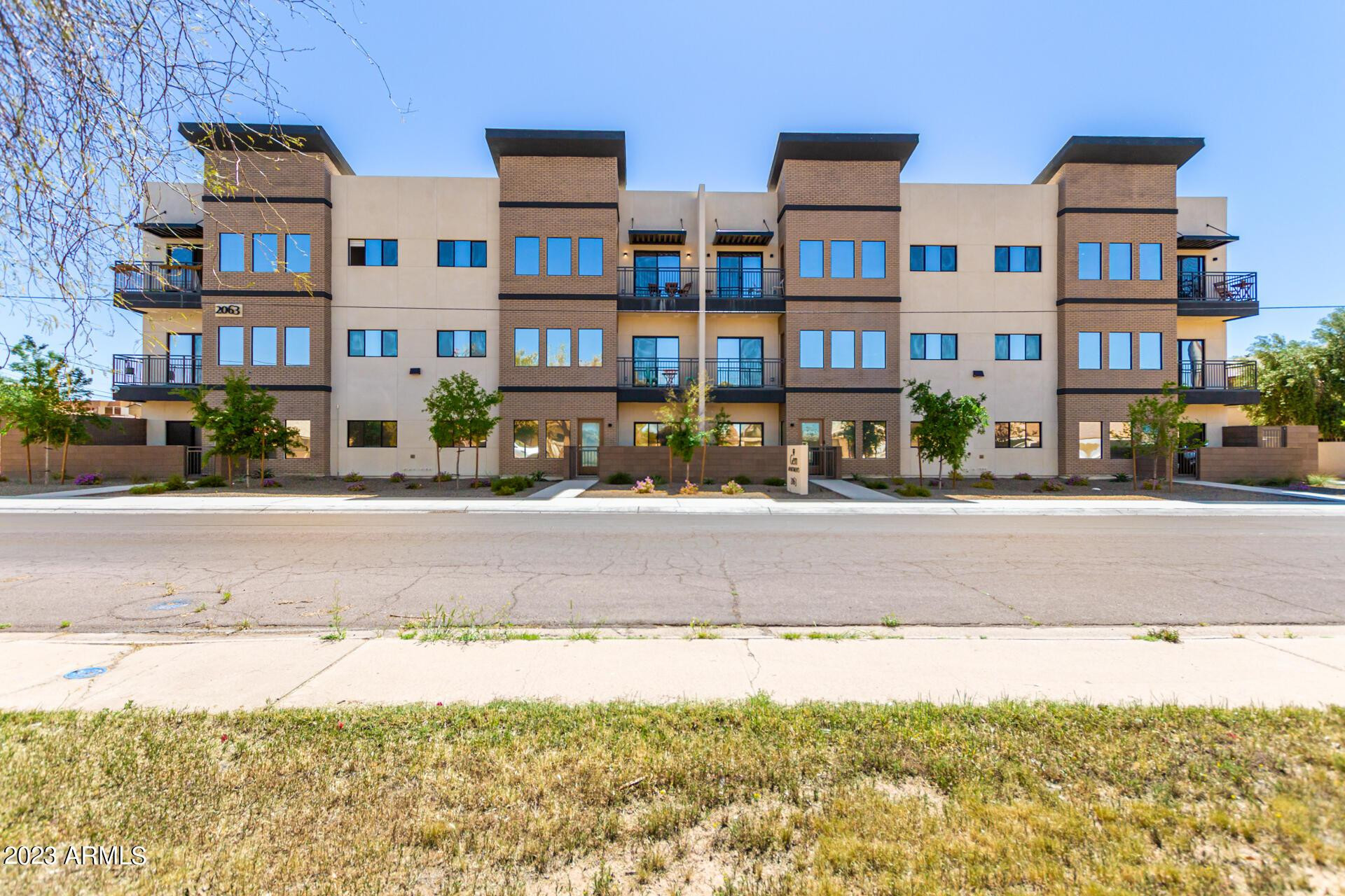 2063 East Lemon Street, Unit 2004 Tempe, AZ 85281 - Photo 1 of 25 a front view of a building with street view