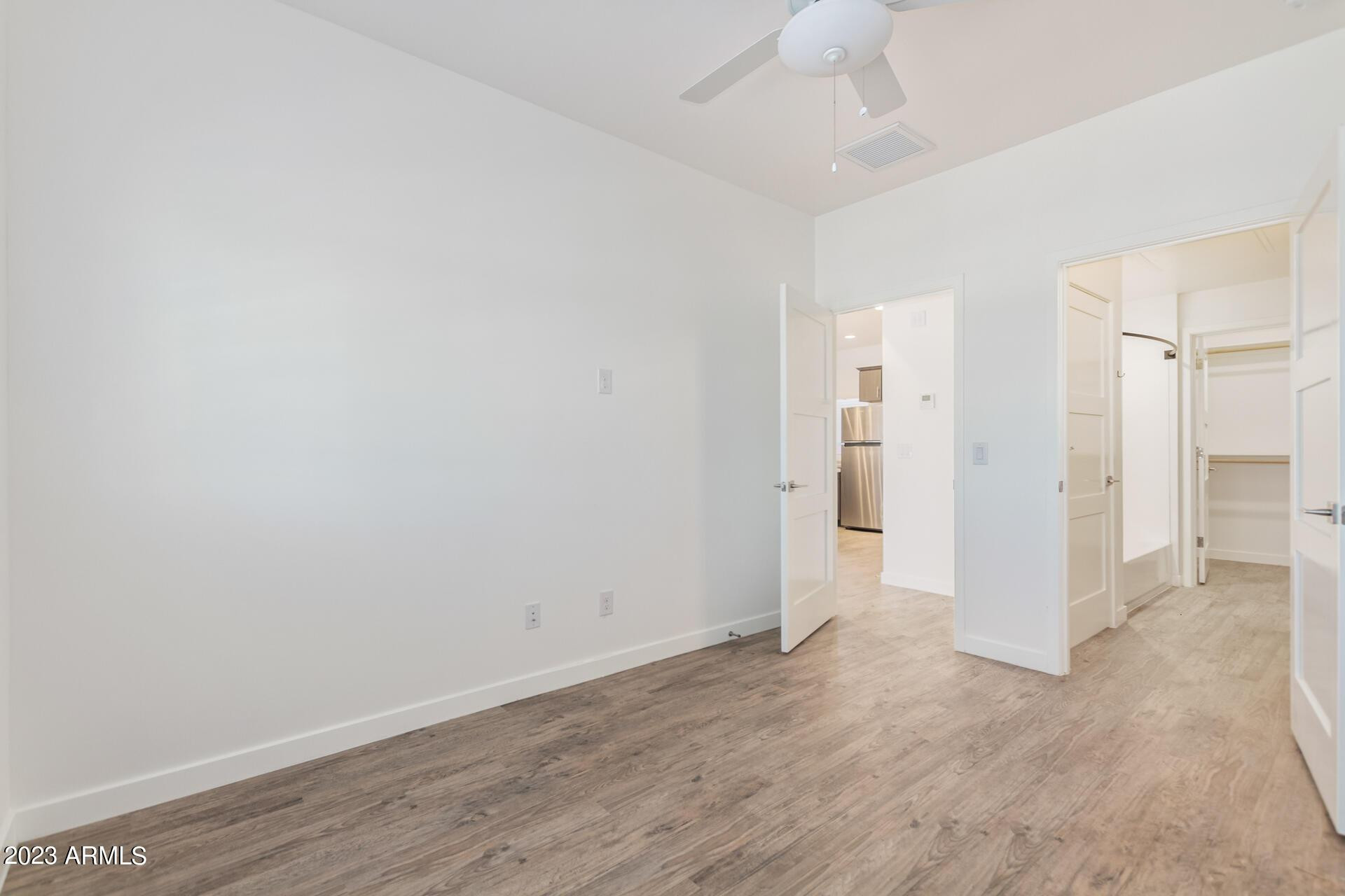 2063 East Lemon Street, Unit 2004 Tempe, AZ 85281 - Photo 13 of 25 a view of an empty room with wooden floor