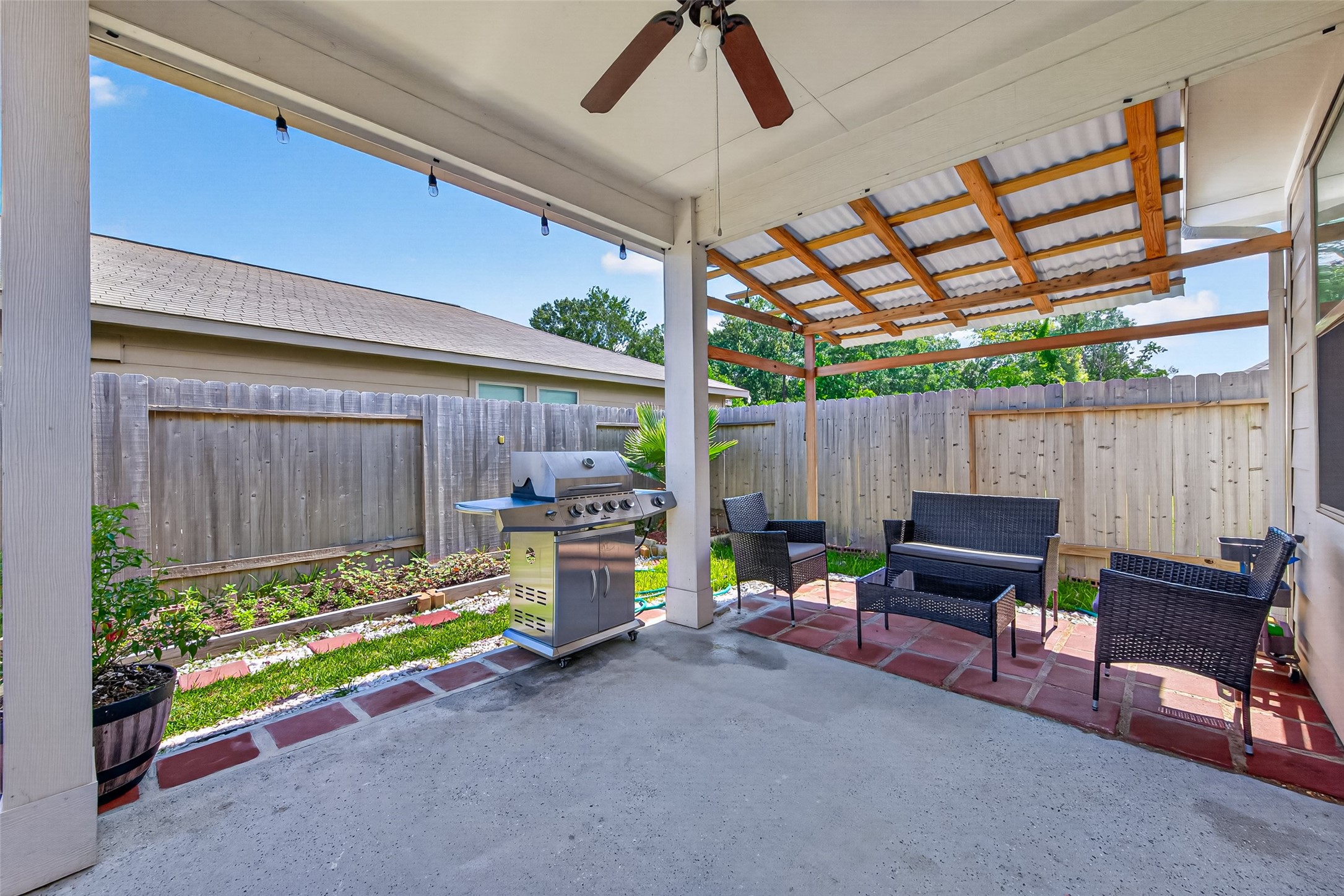 22409 Kinley Street New Caney, TX 77357 - Photo 7 of 46 a view of patio with a table and chairs