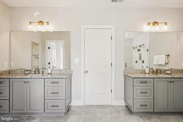 a bathroom with a bathtub and shower