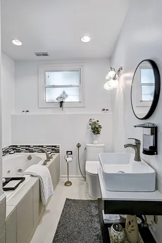 a view of a kitchen area with furniture and wooden floor