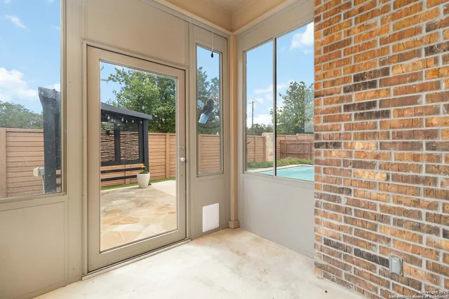a view of a house with swimming pool and sitting area