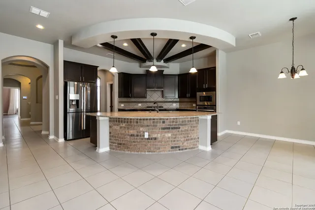 a view of kitchen with cabinets