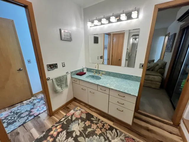 a bathroom with a sink toilet and shower