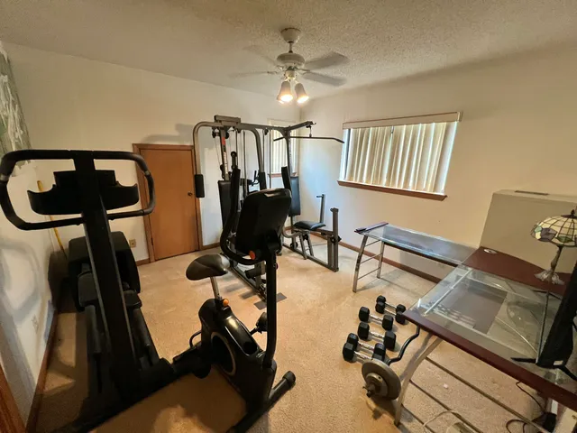 a bedroom with a bed and a television