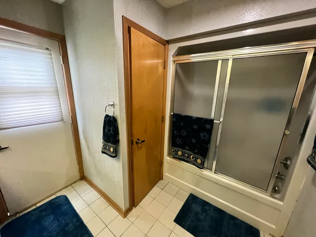 a balcony with furniture and a potted plant