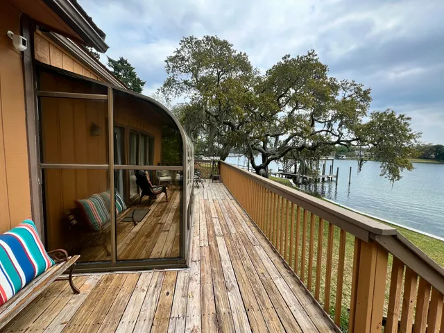 a roof deck with a table and chairs
