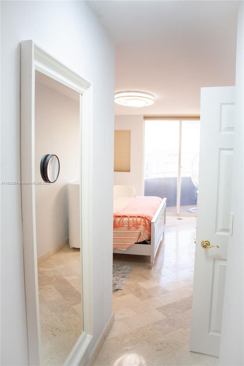 6301 Collins Avenue, Unit 807 Miami Beach, FL 33141 - Photo 26 of 42 a en suite bathroom with a tub sink and shower