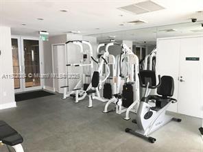 6301 Collins Avenue, Unit 807 Miami Beach, FL 33141 - Photo 7 of 42 a view of a room with gym equipment
