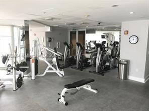 6301 Collins Avenue, Unit 807 Miami Beach, FL 33141 - Photo 8 of 42 a view of a room with gym equipment